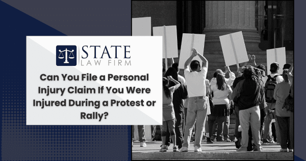 A group holding signs on personal injury claim