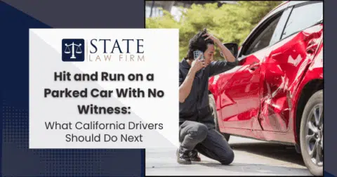 Man inspecting red car