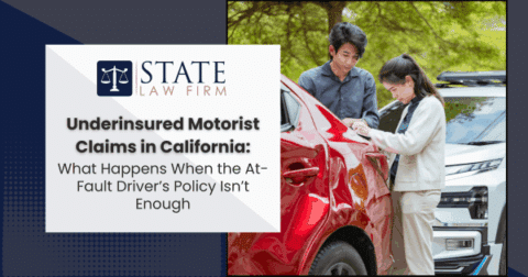 People standing by red car