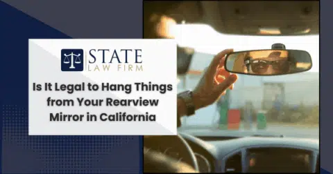 Person photographing their reflection in a car side mirror