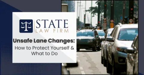 Street with heavy traffic next to law firm sign