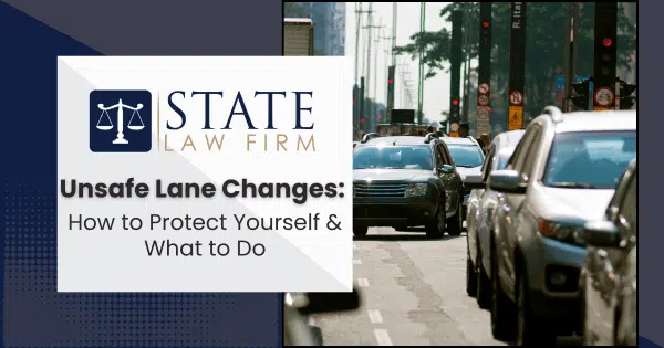 Street with heavy traffic next to law firm sign