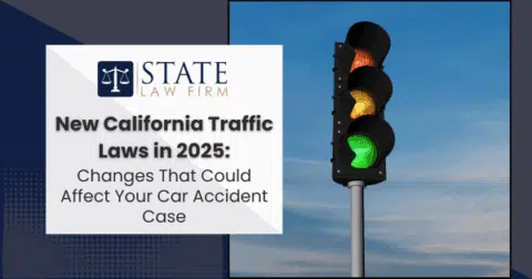 Traffic light with new California traffic laws sign